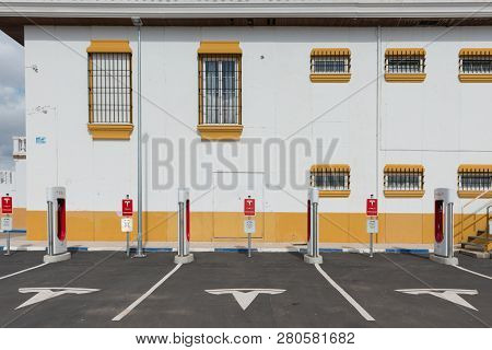 Aguadulce, Seville, Spain - April 29, 2018: A Tesla Electric Supercharger Stand At A Gas Station In 