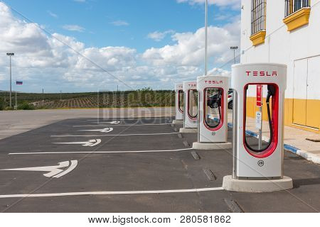 Aguadulce, Seville, Spain - April 29, 2018: A Tesla Electric Supercharger Stand At A Gas Station In 