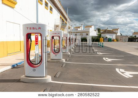 Aguadulce, Seville, Spain - April 29, 2018: A Tesla Electric Supercharger Stand At A Gas Station In 