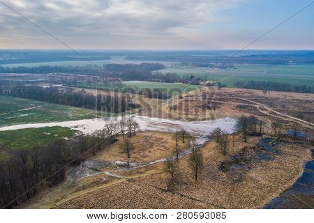 Aerial View Of Small Scale Frisian Landscape With Windbreak Shelter Trees And Pools