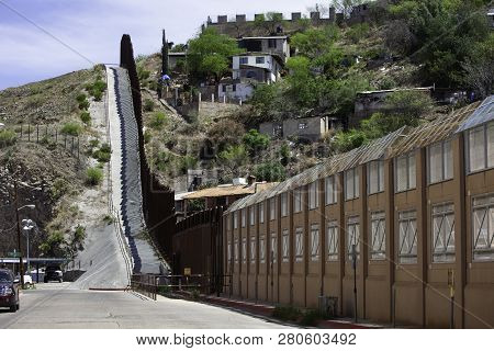 United States Border Wall With Nogales Mexico Neighborhood On The Right