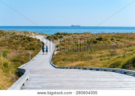 Papamoa Winding Walkway Through Sand Dunes And Outllok To Horizon With Two Peopletauranga New Zealan