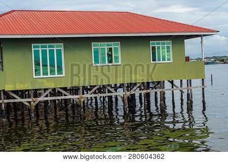 Labuan,malaysia-jan 15,2019:wooden Houses Built On Stilts On Water In Patau Patau,labuan,malaysia.it