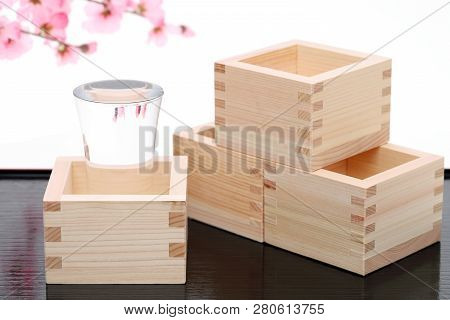 Japanese Wooden Box Masu With Sake On White Background