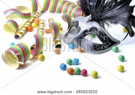 Beautiful Carnival Mask Among Colorful Cotillon On White Background