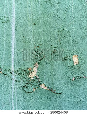 Cracked And Decaying Paint On An Old Wall