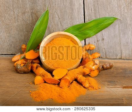 Turmeric  Powder On Wood  Background.turmeric Is The Best Of Herb.