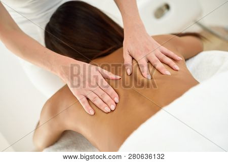 Arab Woman Receiving Back Massage In Spa Wellness Center.