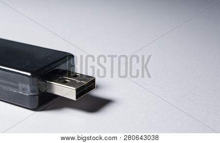 Portable Usb Stick. Memory Card. Data Carrier. Dark Color. On A White Background. The Isolated Objec