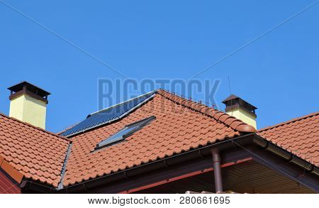 Lightning Rod On Rooftop. House Roof Lightning Protection Systems With Attic Skylight And Solar Wate