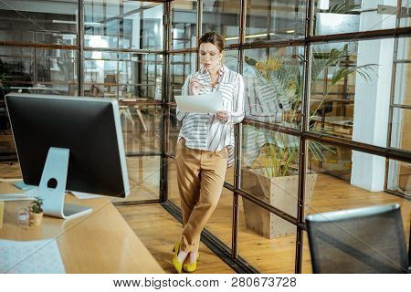 Stylish Woman Wearing Nice Yellow Shoes Standing In Her Office