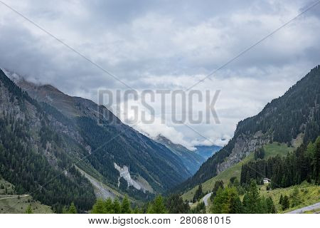 Mountains, Peaks, Lake, Everlasting Ice And Trees Landscape. Kaunertaler Gletscher Natural Environme