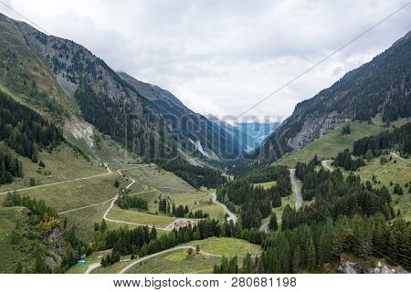 Mountains, Peaks, Lake, Everlasting Ice And Trees Landscape. Kaunertaler Gletscher Natural Environme