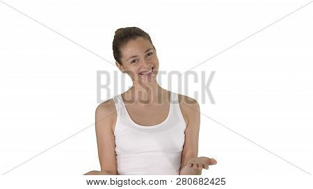 Woman In White Top Explaining Something While Walking On White Background.