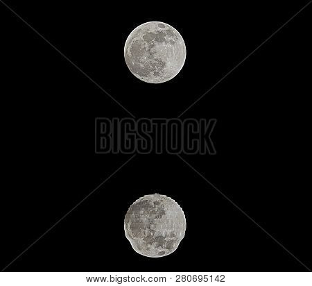 Reflections On The Sea Of A Shining Full Moon In The Dark Night