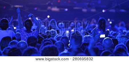 Many Boys And Girls At Live Concert With Blue Lights