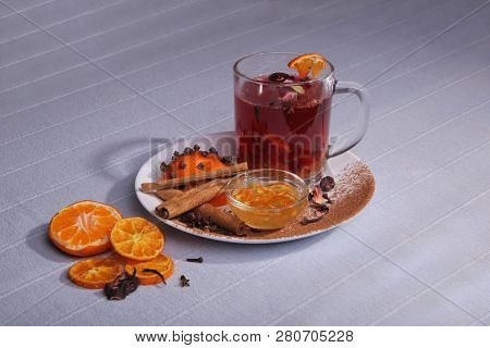 Still Life. A Cup Of Drink. Spices And Fruits On A Plate. Jam And Cinnamon.