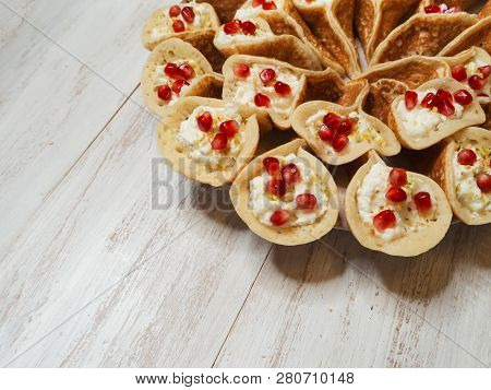 Pomegranate Qatayef Asafiri, Arabian Pancake Stuffed With Sweet Cheese.