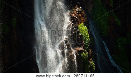 Waterfall Coban Sewu In Java, Indonesia. Waterfall In Tropical Forest By Drone Tumpak Sewu