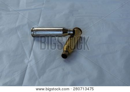 Two Spent Cartridge Shells Are Ready For Reloading.