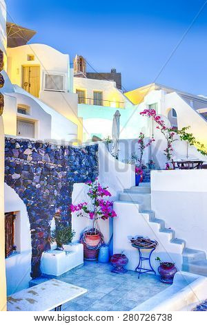 Picturesque View Of Beautiful Oia Hoises In Santorini Island In Greece.vertical Image Comsposition