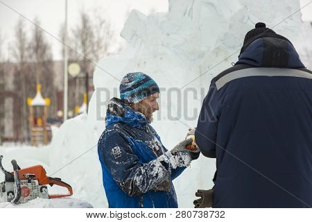 Two Workers At The Installation Of The Ice Camp