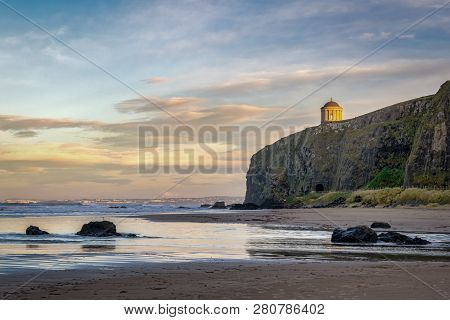 This Is Mussenden Temple On The Edge Of A Sea Cliff At Downhill Beach In Northern Ireland