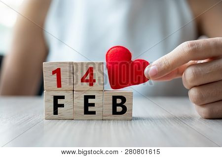 Woman Holding Red Heart Shape Decoration Iwith Wooden Cube On Table Background. Love, Wedding, Roman