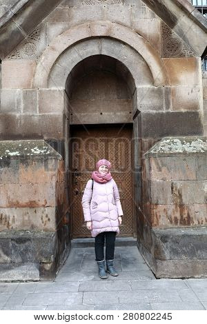Woman Posing On Etchmiadzin Cathedral Background