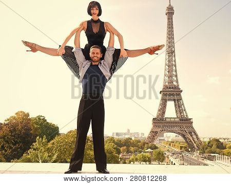 Dance Couple In Front Of Eifel Tower In Paris, France. Beatuiful Ballroom Dance Couple In Dance Pose