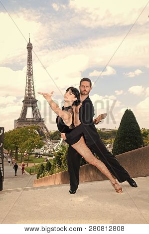 Dance Couple In Front Of Eifel Tower In Paris, France. Beatuiful Ballroom Dance Couple In Dance Pose