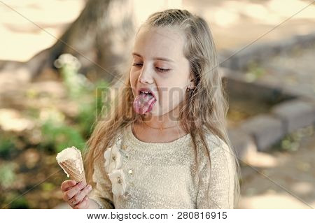 Kid Girl With Ice Cream Cone In Hand. Summer Treats Concept. Sweet Tooth Girl Child With White Ice C