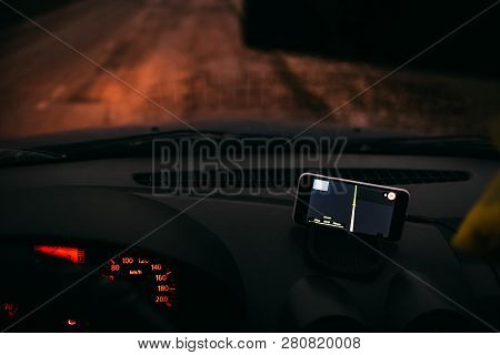 Night Road In The Car Navigator On The Phone