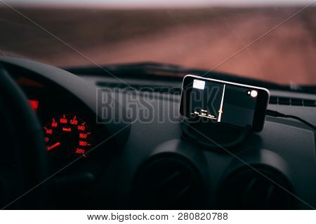 Night Road In The Car Navigator On The Phone