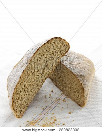 Bright Image Of Two Halves Of A Homemade Spelt Bread On A White Background Copy Space, Triticum Spel