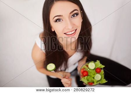 Diet. The Concept Of Healthy And Unhealthy Nutrition. The Model Plus Size Makes A Choice In Favor Of