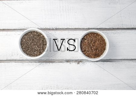 Small Bowl With Chia Seeds And Flax Seeds With Vs Sign Seen Directly From Above On Grey Background. 