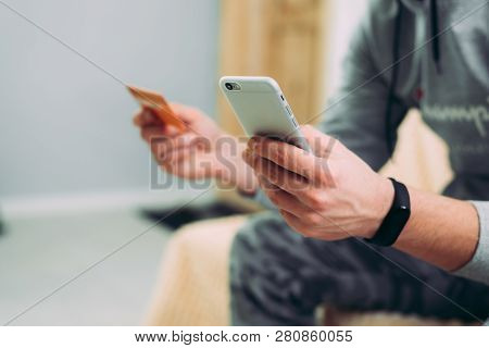 Online Payment, Hands Holding Credit Card And Using Smartphone