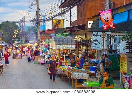 Pai, Thailand - Jan 03, 2017: People Walking On  Pai Night Market At Twilight. Pai Is The Famous Tou
