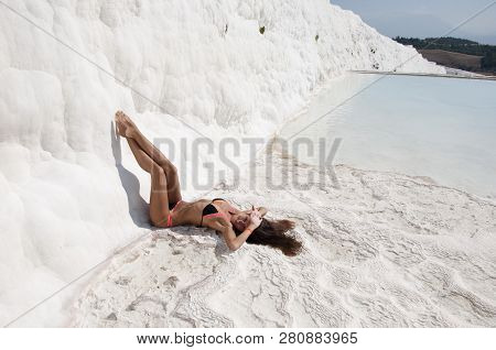 Sexy Woman With Fit Suntan Body. Natural Travertine In Pamukkale. Beach Life. Cotton Castle In South