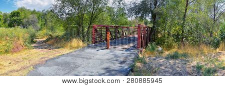 Views Of Jordan River Trail Pedestrian And Train Track Bridge With Surrounding Trees, Russian Olive,