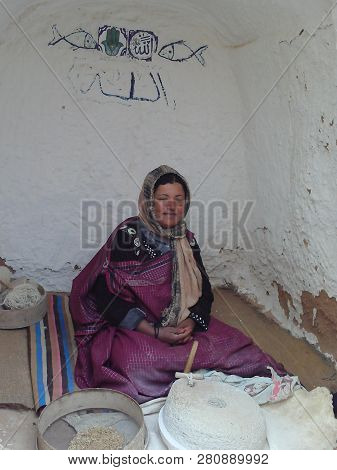 Matmâta, Tunisia - April 15, 2018: Berber Woman In Wonderful Underground Homes Built By Berber Peopl