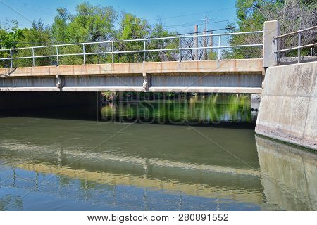 Views Of Jordan River Trail Pedestrian And Train Track Bridge With Surrounding Trees, Russian Olive,
