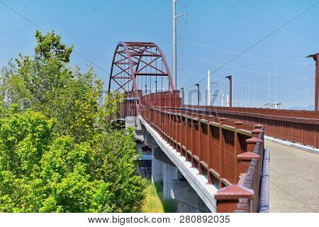 Views Of Jordan River Trail Pedestrian And Train Track Bridge With Surrounding Trees, Russian Olive,