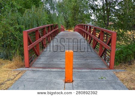Views Of Jordan River Trail Pedestrian And Train Track Bridge With Surrounding Trees, Russian Olive,