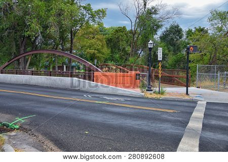 Views Of Jordan River Trail Pedestrian And Train Track Bridge With Surrounding Trees, Russian Olive,