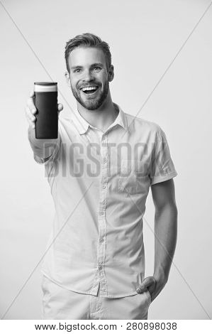 Man Show His Favorite Shower Gel Or Lotion For Body. Guy Satisfied With Shower Gel. Man Bearded Styl