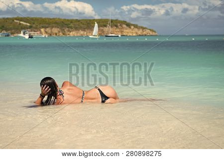Woman With Sexi Ass Lie In Transparent Sea Or Ocean Water In Antigua Under Blue Sky On Idyllic Sunny