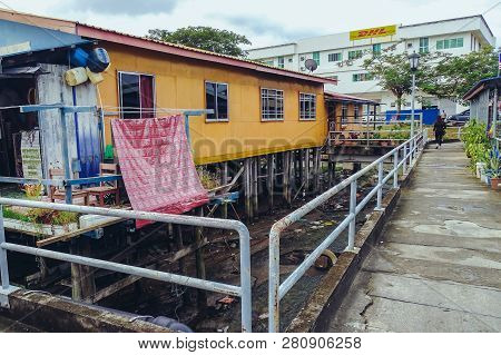 Labuan,malaysia-jan 15,2019:wooden Houses Built On Stilts On Water In Patau Patau,labuan,malaysia.it