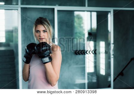 Female Boxer Is Training Punching In Fitness Gym.,portrait Of Boxing Woman Is Practicing Footwork In